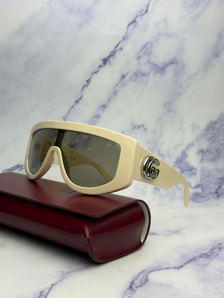 Gucci GG1257S Gafas de sol redondeadas con lentes marrones y rojos