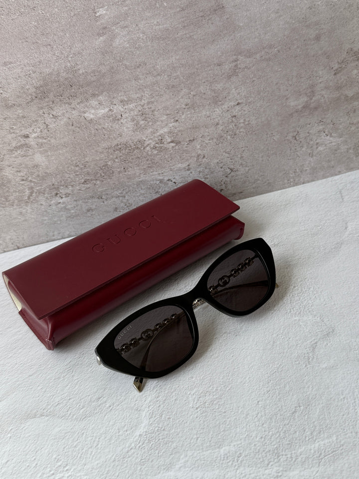 Gucci cat-eye sunglasses, black frames with dark lenses
