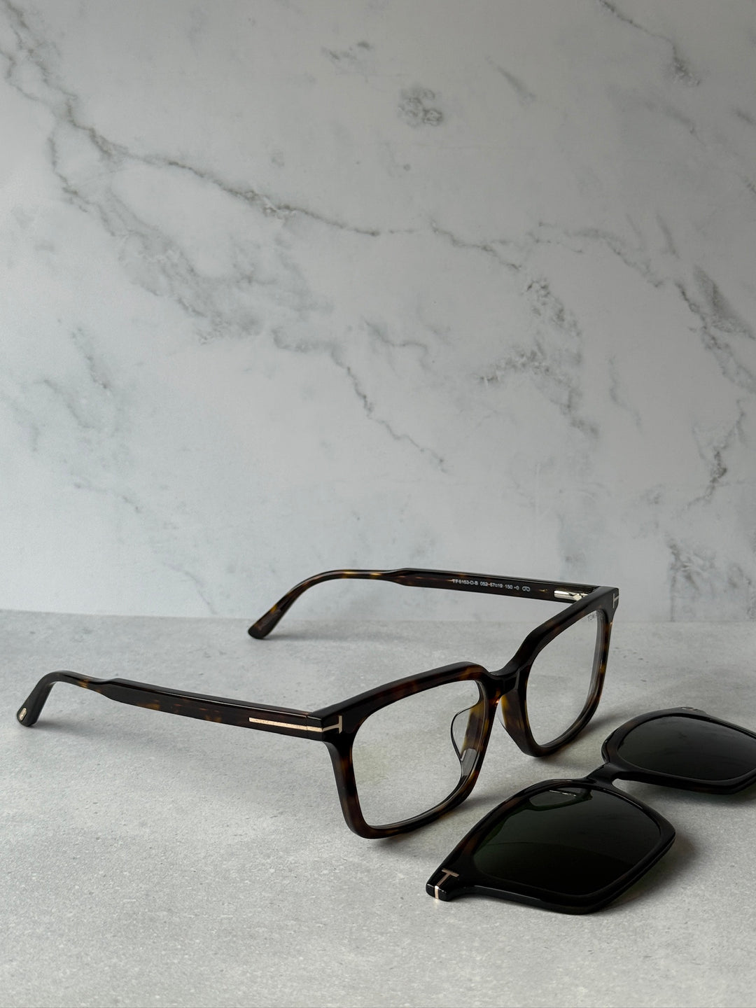 Dark havana eyeglass frames with clip-on sunglasses plus spare lens piece
