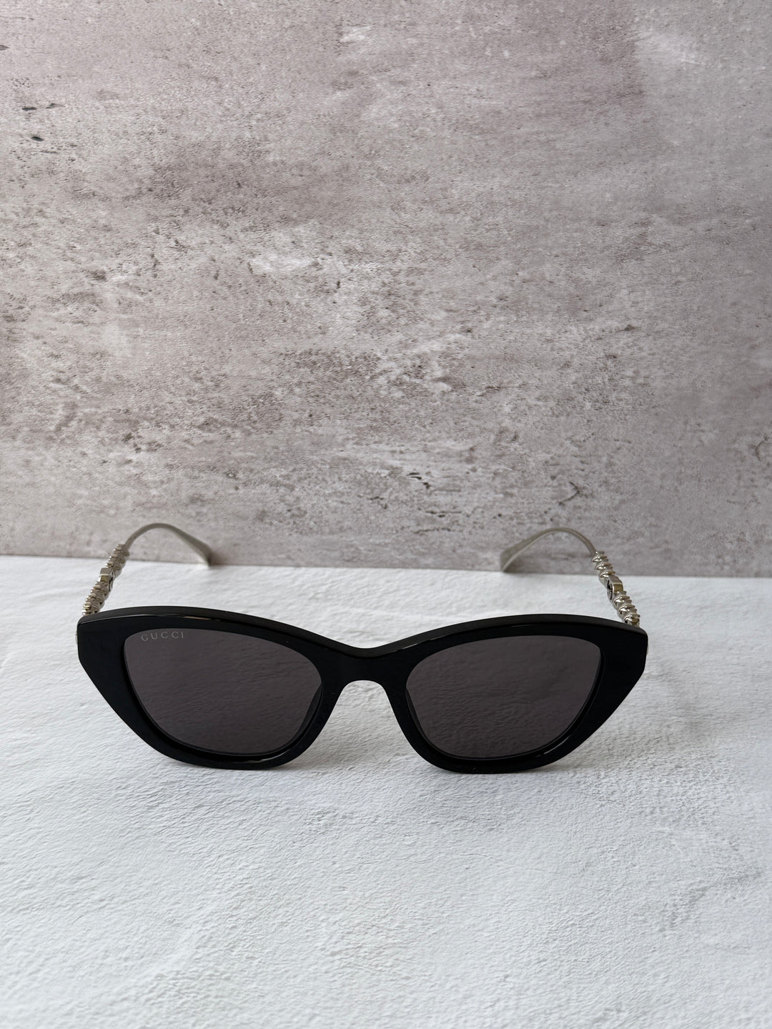 Gucci cat-eye crystal sunglasses, black frames with dark lenses and sparkly temples