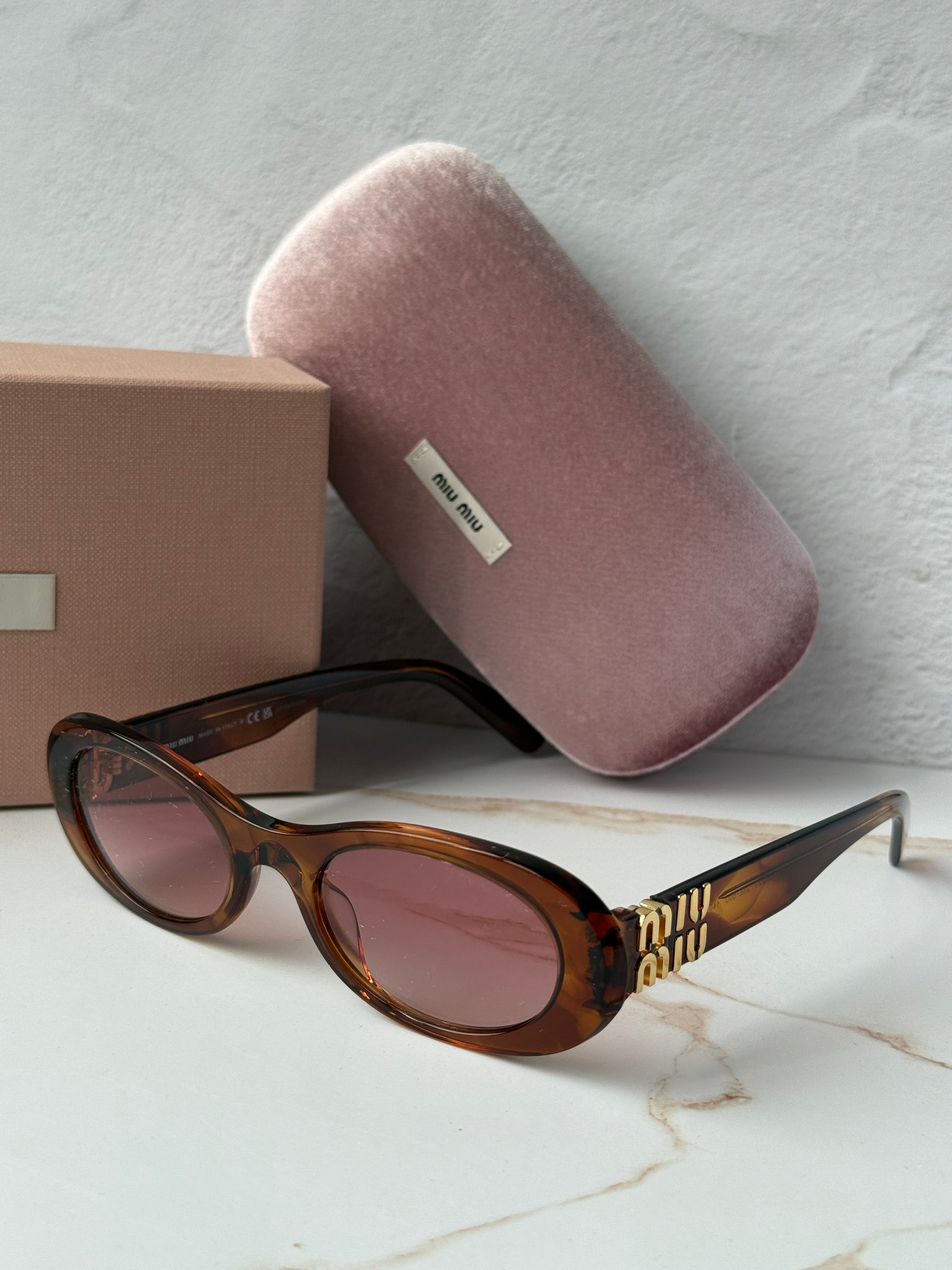 Miu Miu MU06ZS Tobacco Brown Red Oval Sunglasses | Designer Daydream