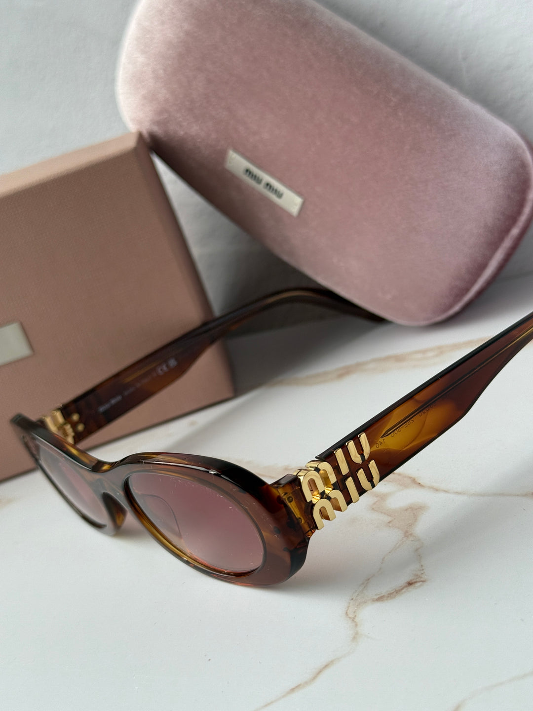 Miu Miu MU06ZS Tobacco Brown Red Oval Sunglasses
