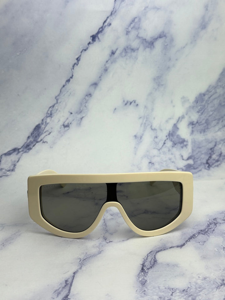 Gucci GG1257S Gafas de sol redondeadas con lentes marrones y rojos