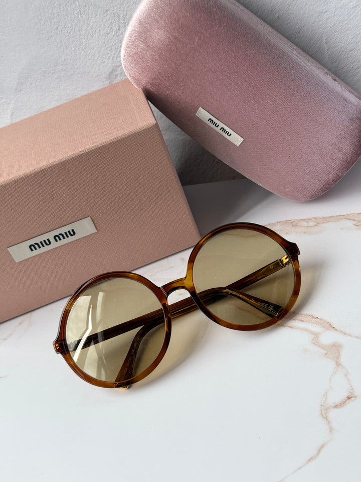 Miu Miu round sunglasses, brown tortoiseshell frames, gold-tone hinge detail