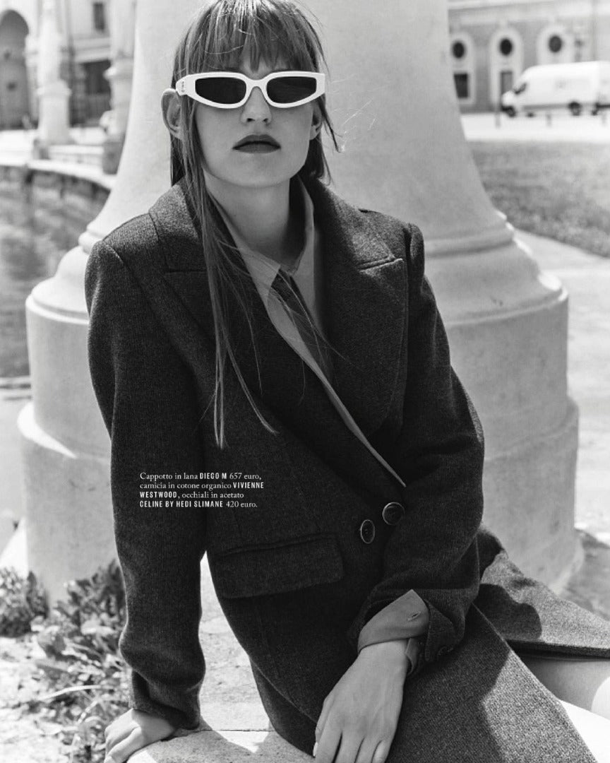 Celine Triomphe white sunglasses with dark lenses on face