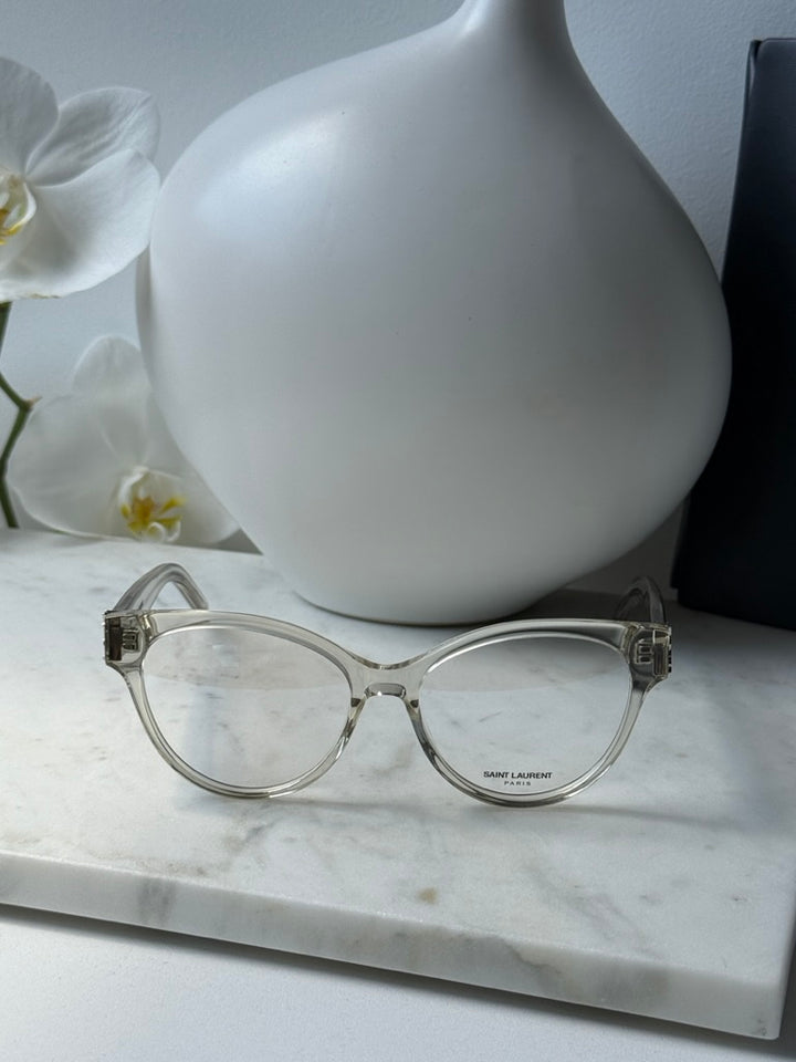 Saint Laurent clear cat-eye eyeglass frames, front view on display