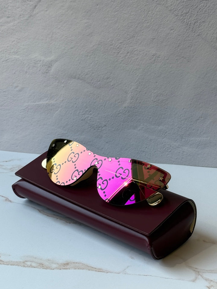 Gucci GG0666S Gafas de sol rosa espejadas con logo de ojo de gato