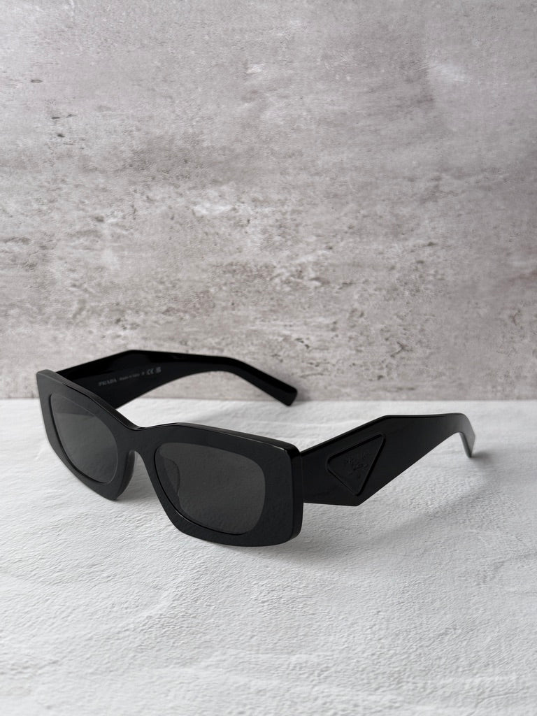 Black PRADA square sunglasses with dark lenses, side profile view