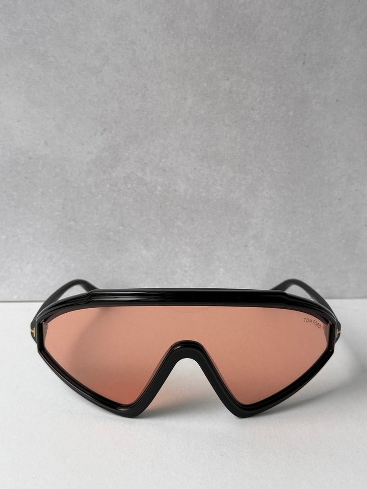 Black sunglasses with orange-tinted lenses, front view