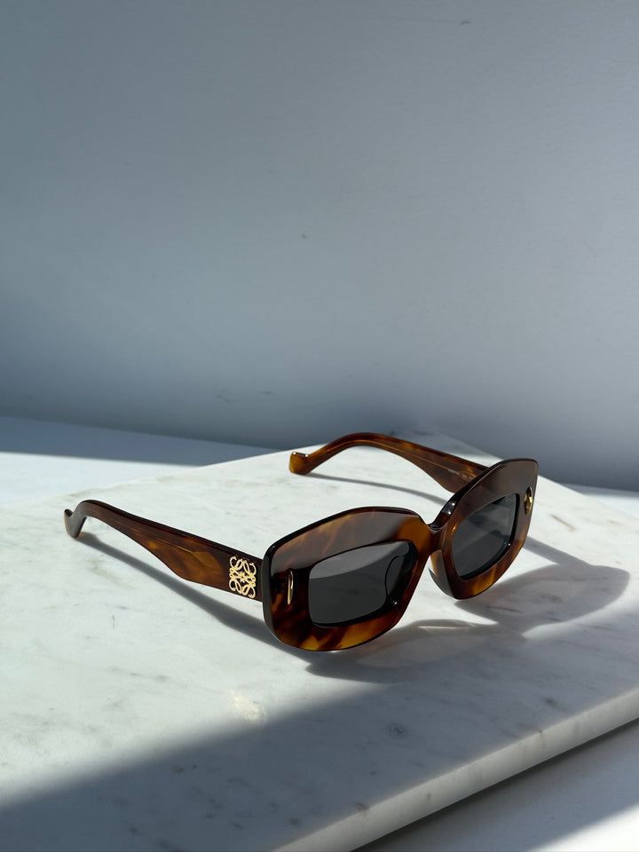 Loewe Havana brown anagram sunglasses with dark lenses, side view with logo detail