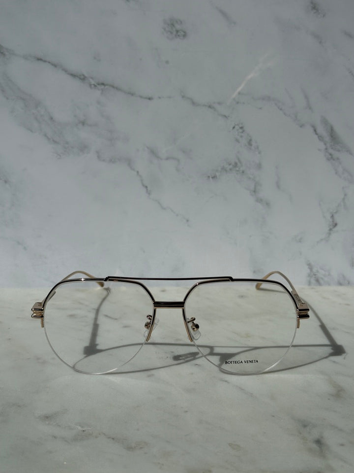 Gold aviator eyeglass frames with clear lenses, front view