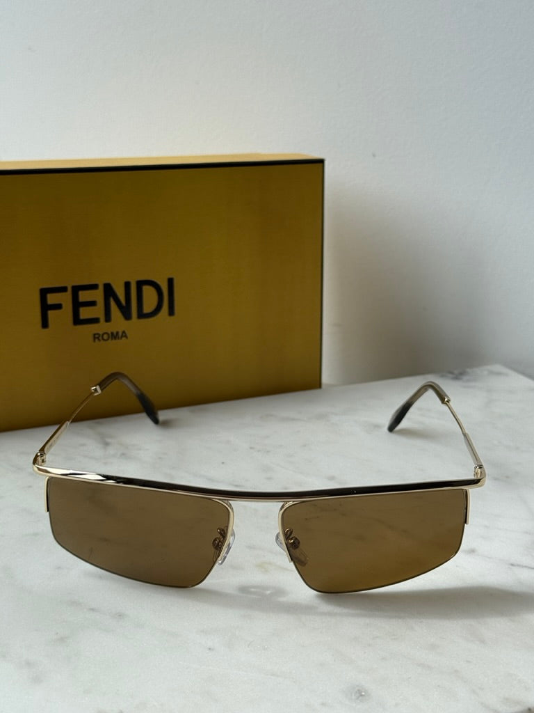 Fendi metal sunglasses with gold frame and brown lenses, front view
