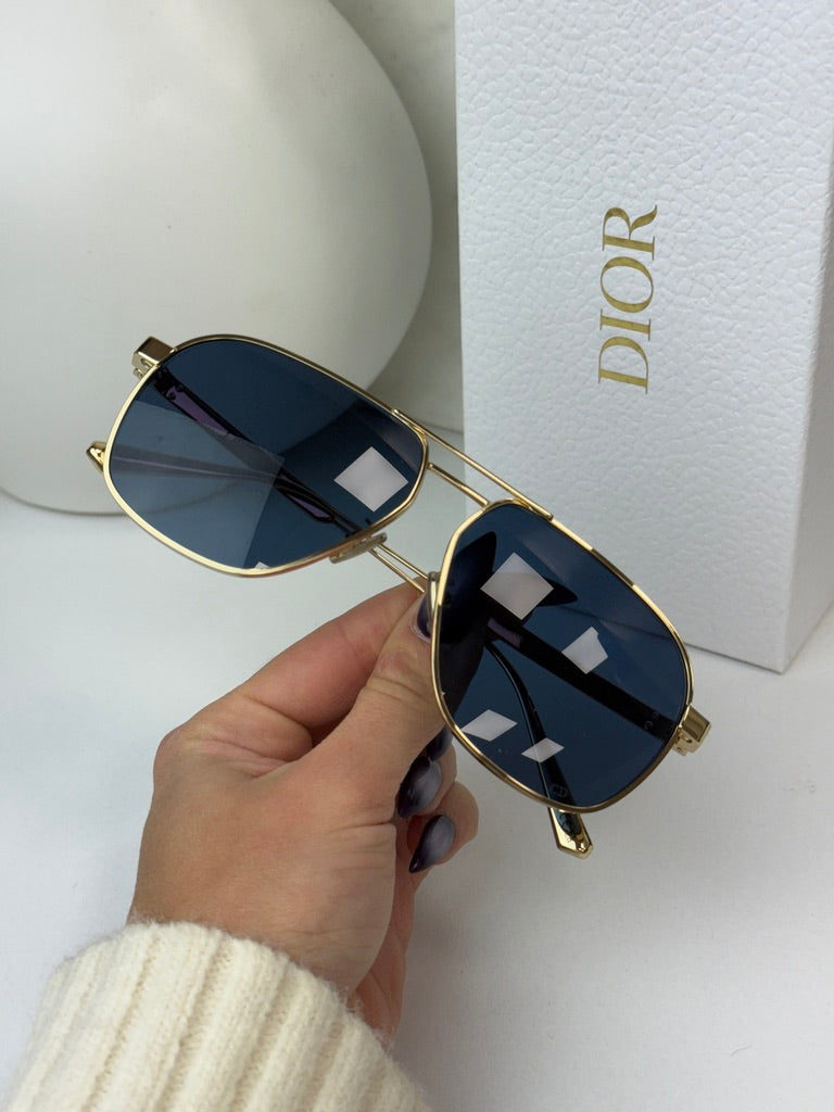 Gold aviator sunglasses with mirrored dark blue lenses and ornate metal frame