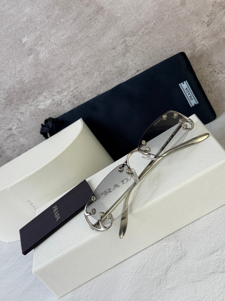 Prada PR C57S Rimless Sunglasses in Silver Grey