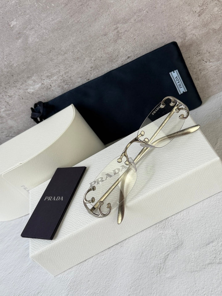 Prada PR C57S Rimless Sunglasses in Silver Bluelight