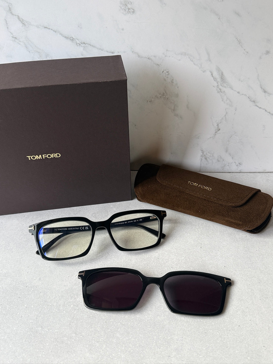 Black rectangular sunglasses with dark clip-on over clear frames