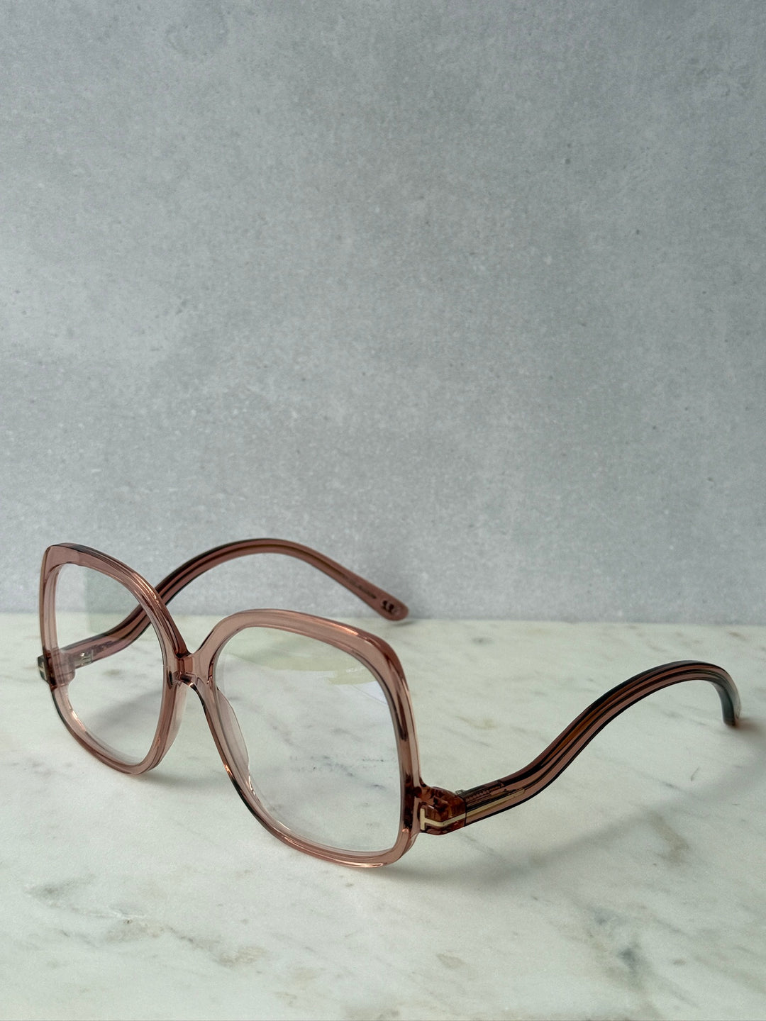 Pink oversized blue-light glasses frames, angled front with clear lenses