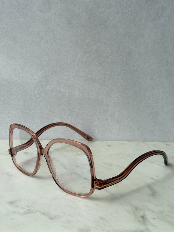 Pink oversized blue-light glasses frames, angled front with clear lenses