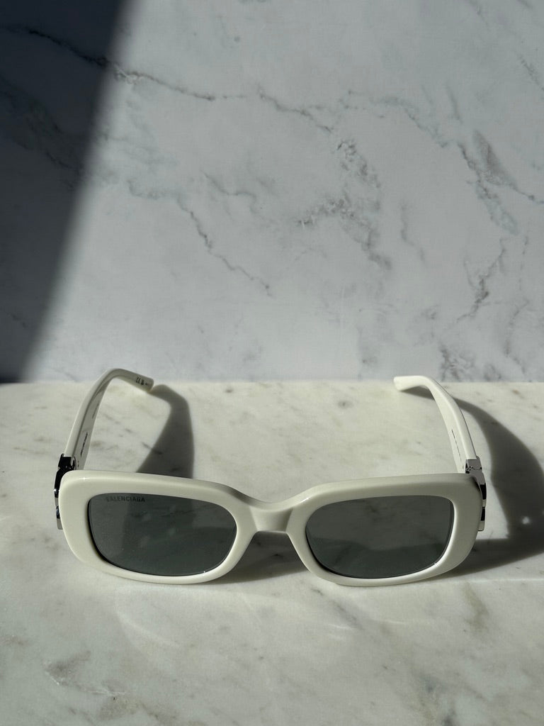 White square sunglasses with dark lenses and slim temples, front view