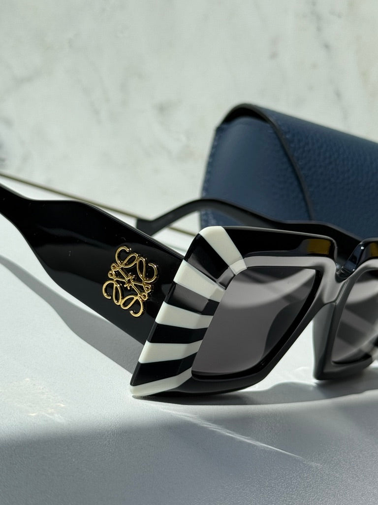 Loewe square sunglasses, black frames with white striped temples and gold emblem