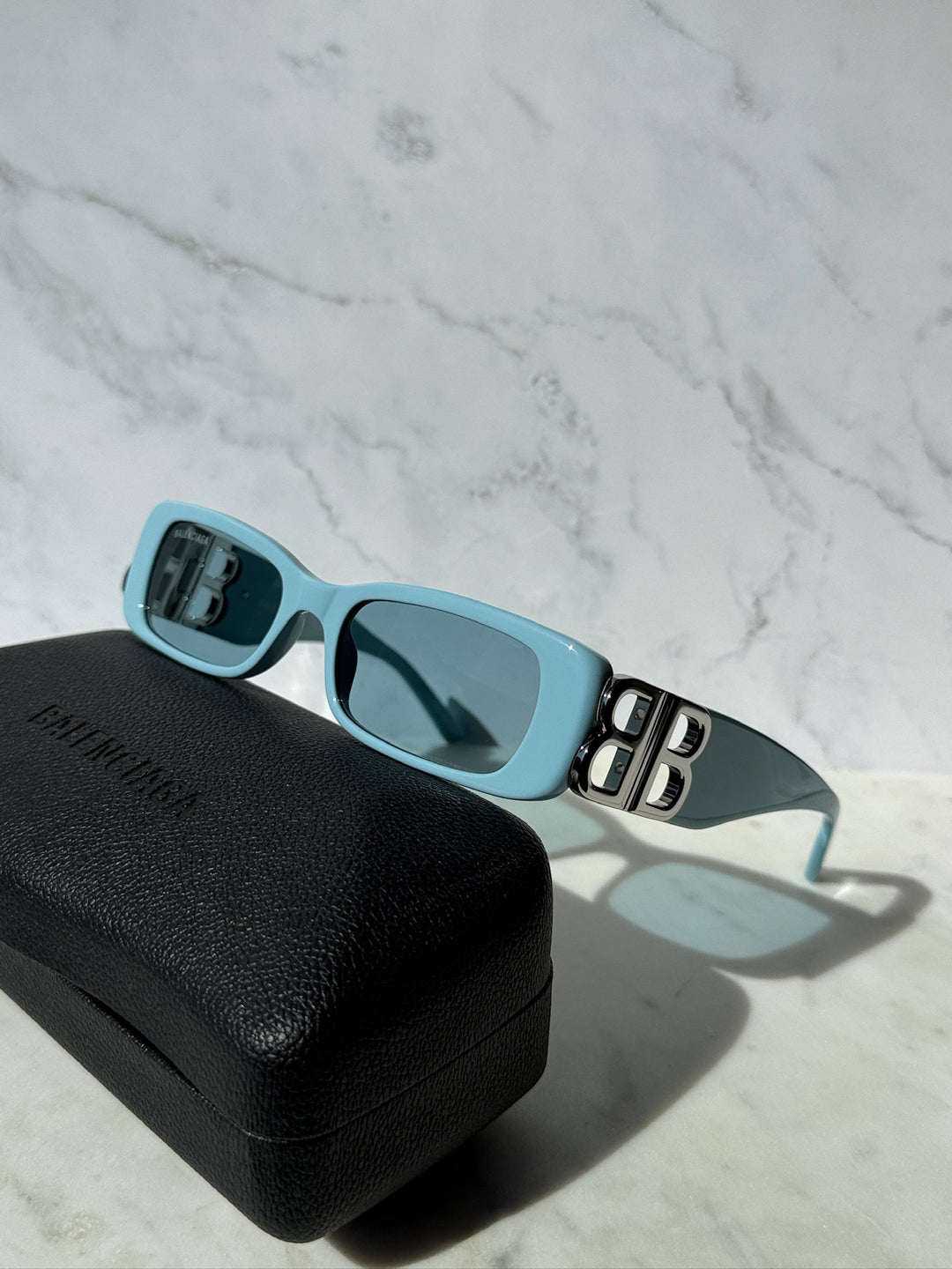 Balenciaga baby blue sunglasses, side view with BB logo temple detail