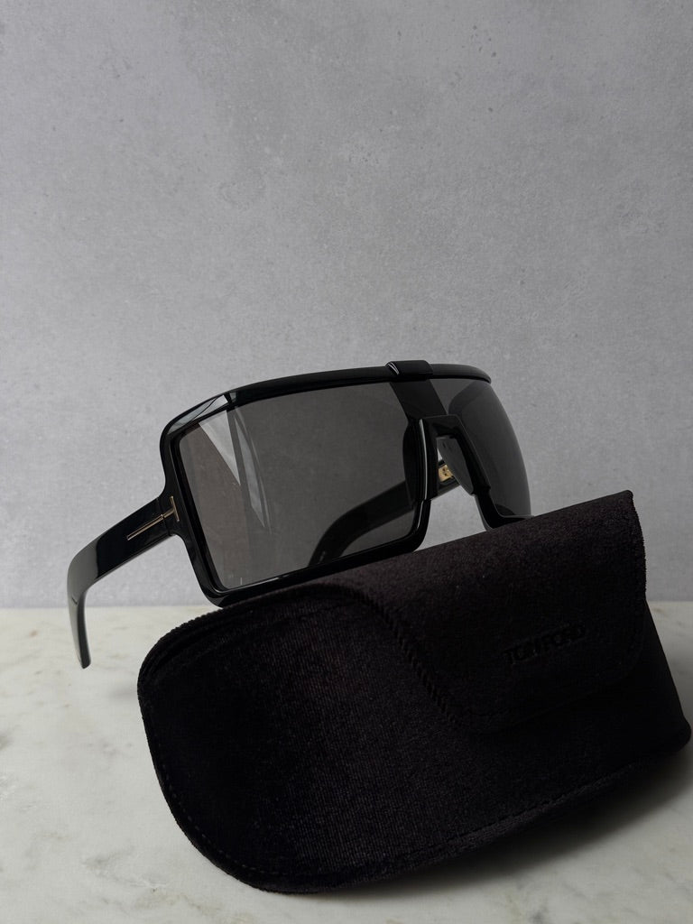Black mask-style sunglasses with dark tinted lenses and black protective pouch