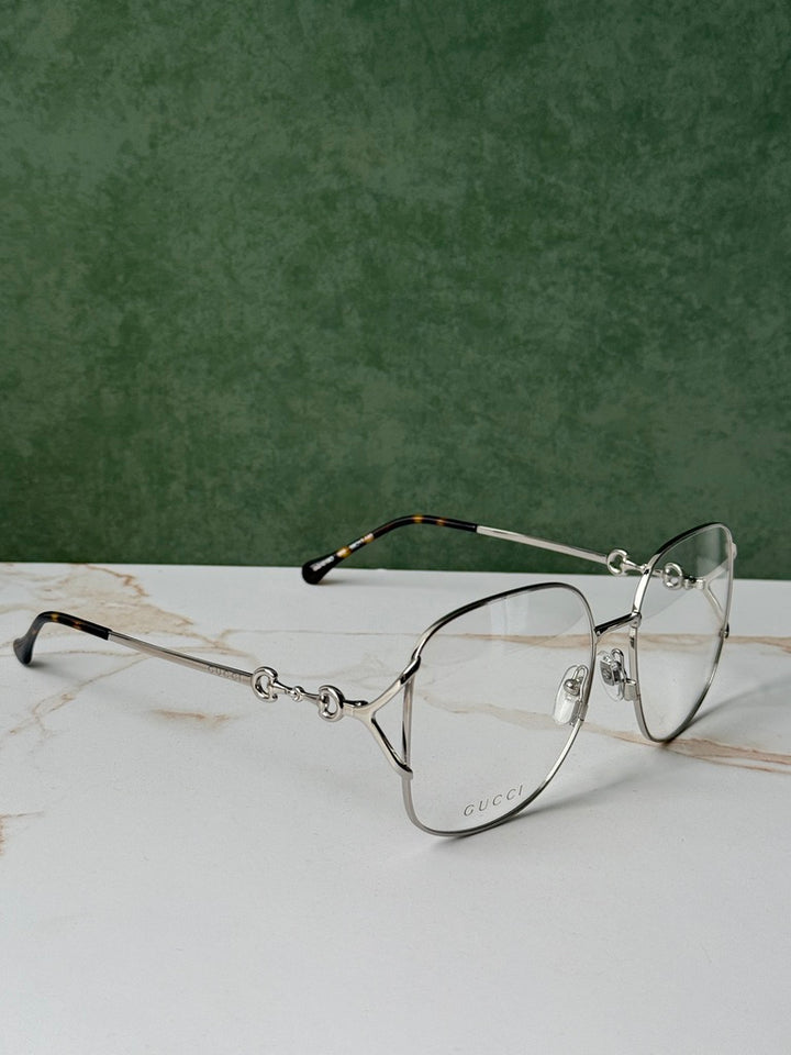 Gucci GG0973O Marcos de metal plateado