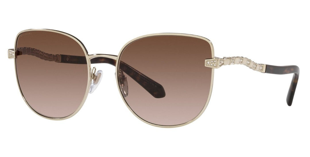 Cat-eye sunglasses with light gold frame, brown gradient lenses, rhinestone temple accents