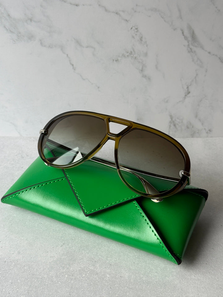 Khaki aviator sunglasses with dark gradient lenses and metal frame