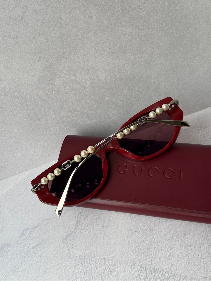 Gucci GG1257S Gafas de sol redondeadas con lentes marrones y rojos