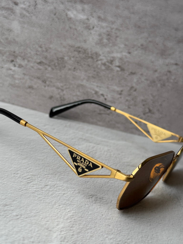 Gafas de sol Prada PR A51S en dorado rosa 