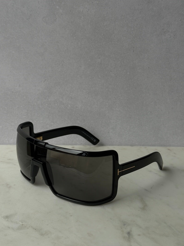 Black mask-style sunglasses with wide rectangular lenses, dark tint