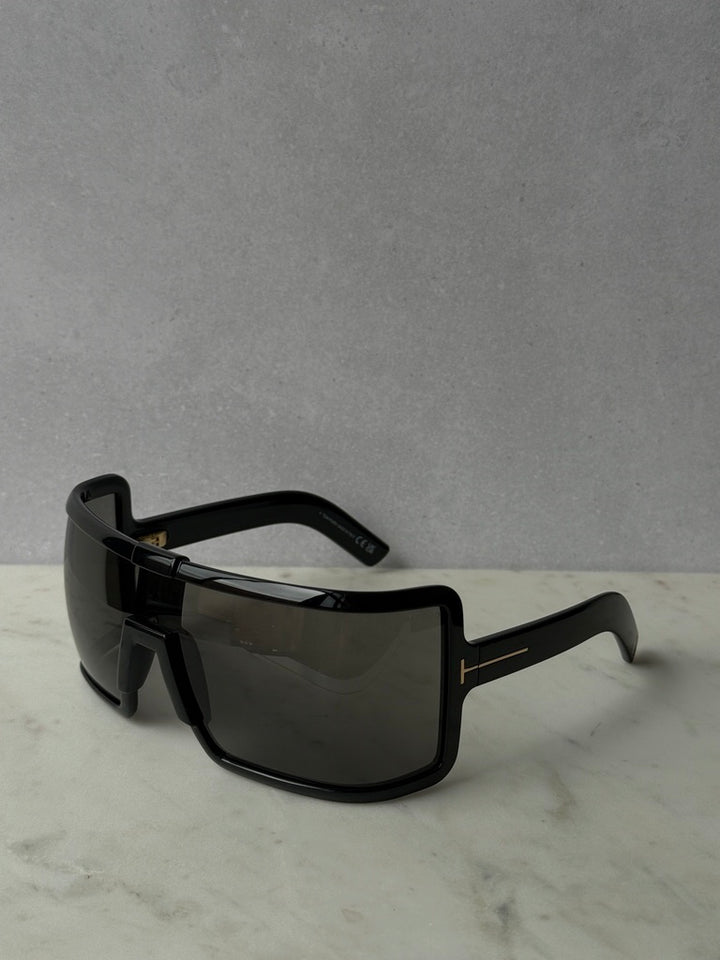 Black mask-style sunglasses with wide rectangular lenses, dark tint