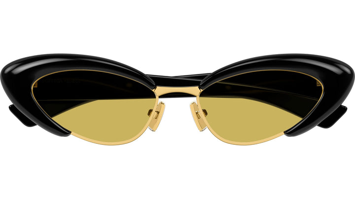 Cat-eye sunglasses with glossy black frame, gold bridge and arms, amber tinted lenses