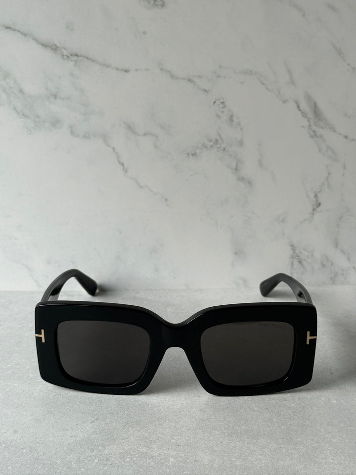 Black oversized square sunglasses, front view with dark lenses
