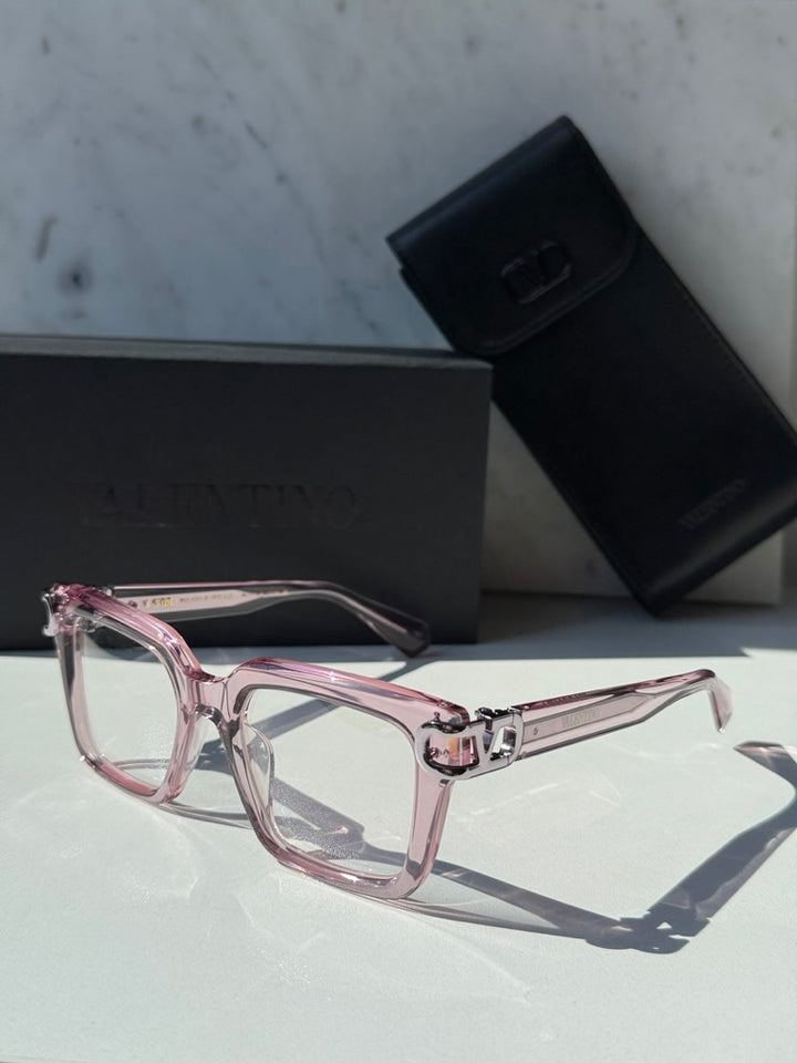 Pink square eyeglasses with clear lenses and chrome V logo temple detail