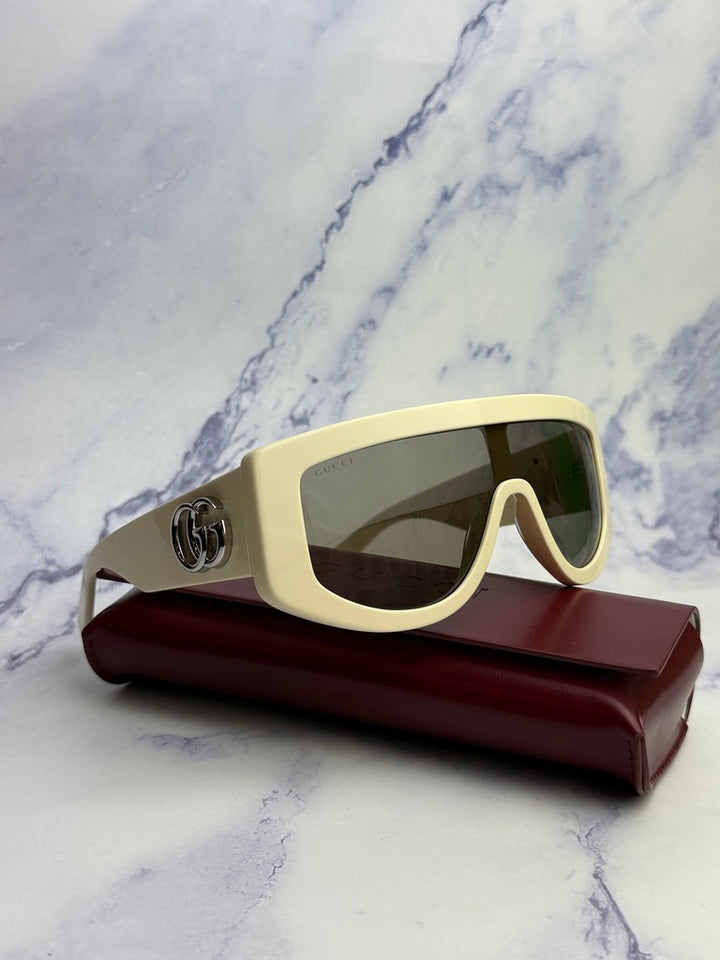 Gucci GG1257S Gafas de sol redondeadas con lentes marrones y rojos