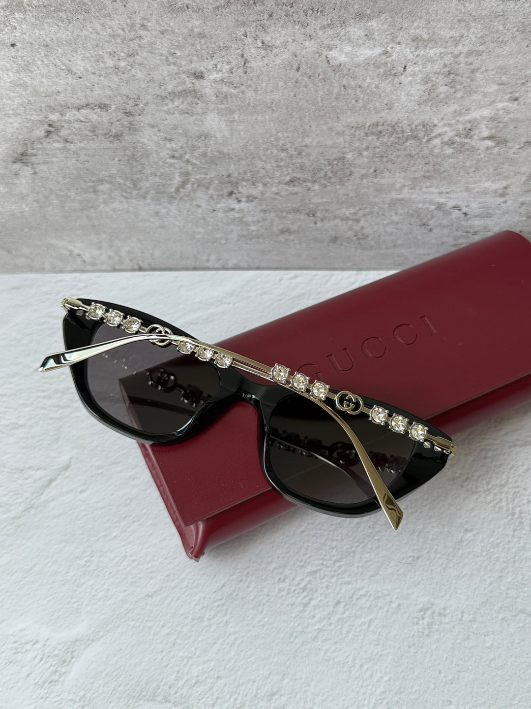 Gucci cat-eye crystal sunglasses, black frame with jeweled gold-tone temple