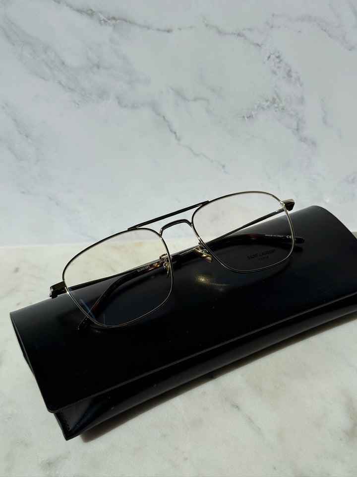 Gold aviator eyeglass frames with dark-tinted lenses and thin metal temples.