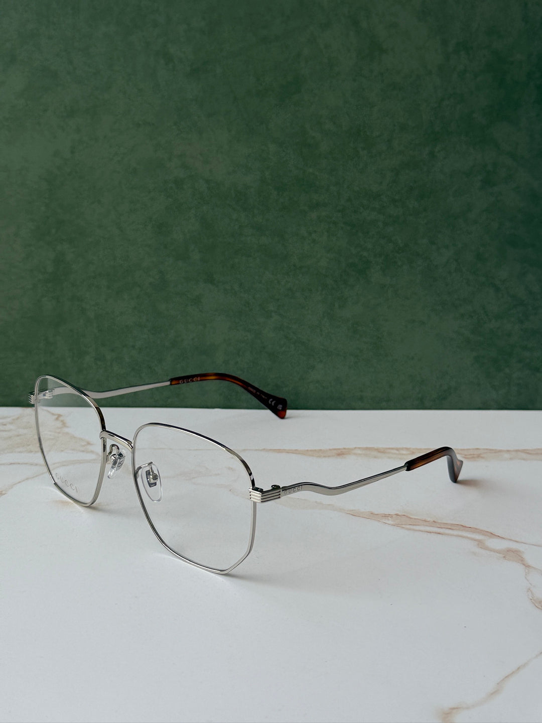Gucci GG0973O Marcos de metal plateado