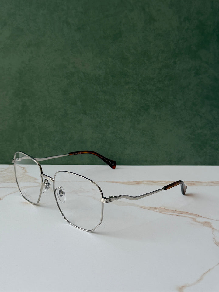 Gucci GG0973O Marcos de metal plateado