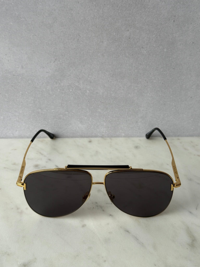 Gold aviator sunglasses front view with dark lenses