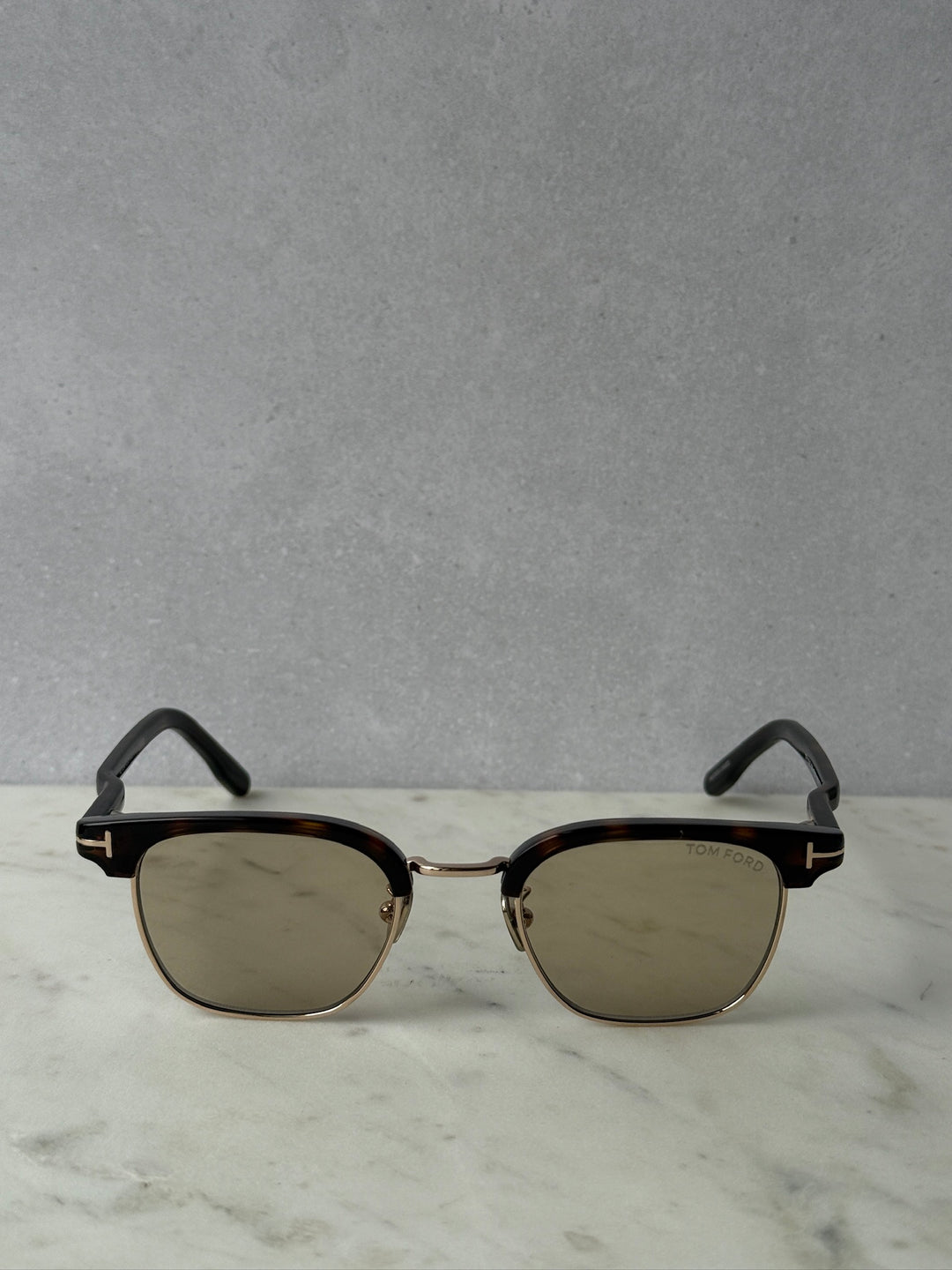 Round dark Havana brown sunglasses with brown tinted lenses and gold metal bridge