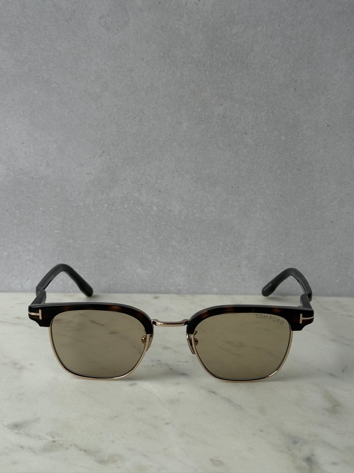 Round dark Havana brown sunglasses with brown tinted lenses and gold metal bridge