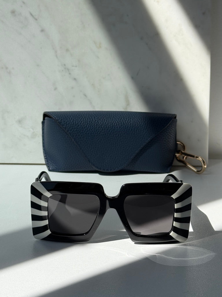 Loewe square sunglasses with black-and-white striped frame and dark lenses