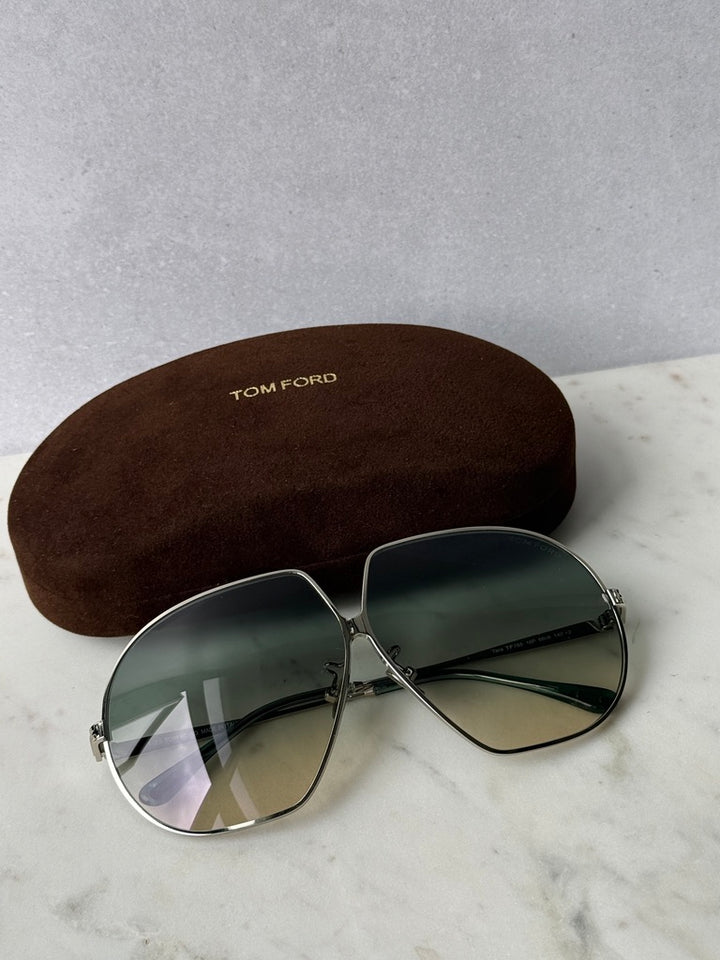 Oversized silver-toned sunglasses with dark green lenses and silver hinges