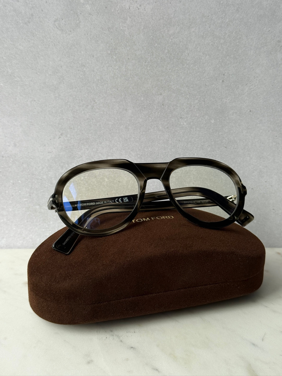 Dark Havana blue-light eyeglass frames with clear lenses and metal temples