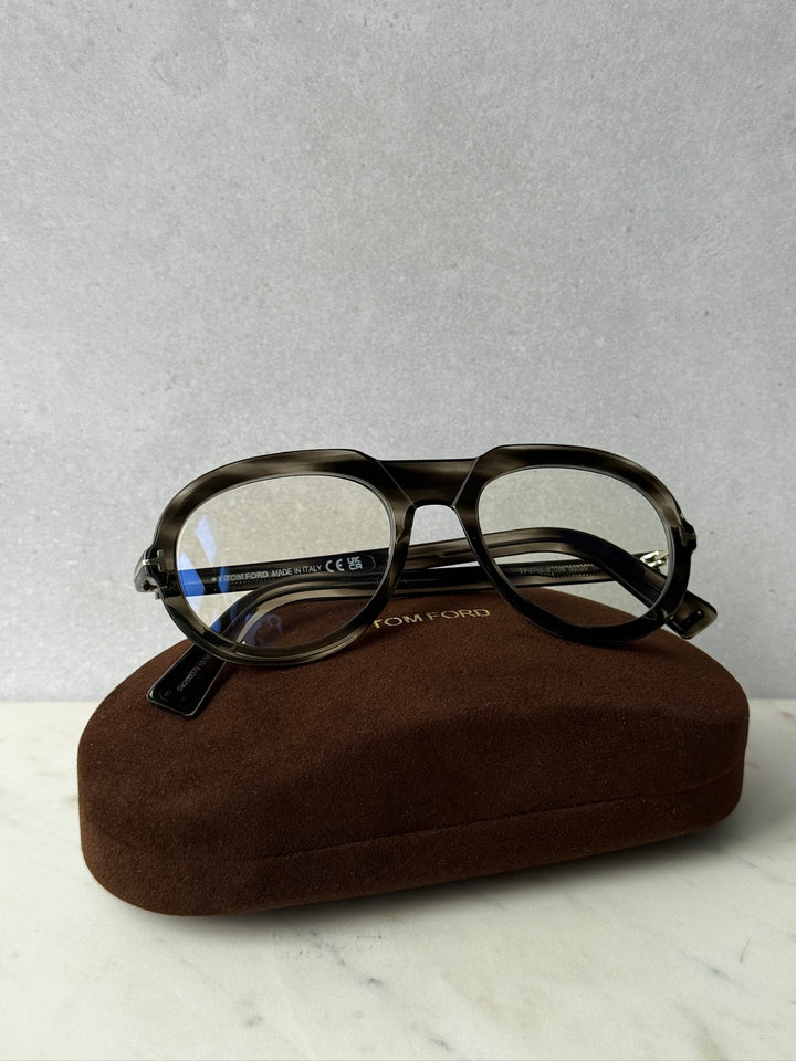 Dark Havana blue-light eyeglass frames with clear lenses and metal temples