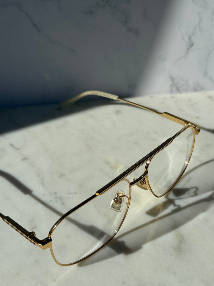 Gold pilot eyeglass frames with clear lenses, rectangular aviator shape