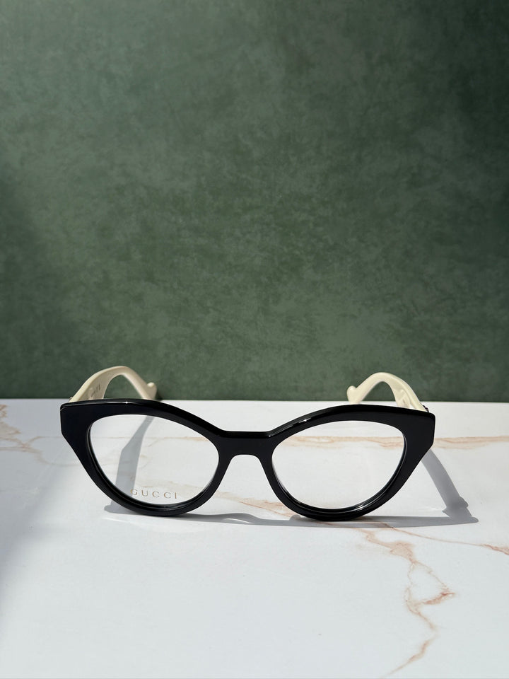 Monturas estilo ojo de gato Gucci GG0959O en negro marfil 